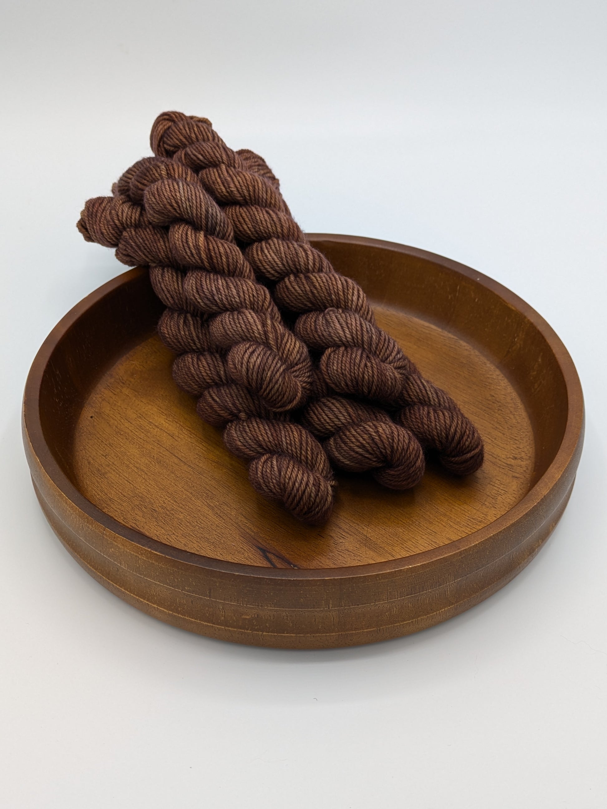 Cocoa DK weight mini skeins showcasing a rich chocolate color