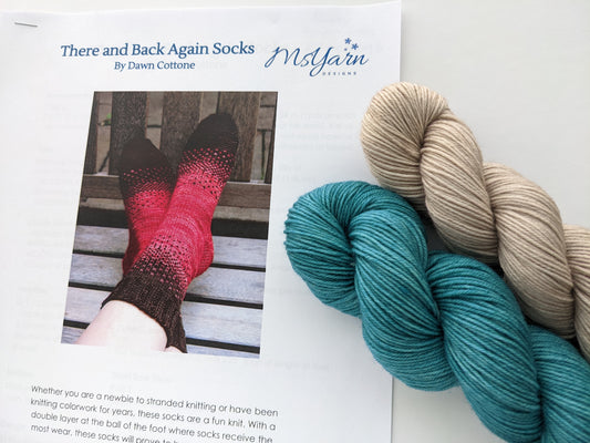 Image of There & Back Again sock knitting kit showing blue and tan yarn colors and knitted sock pattern detail