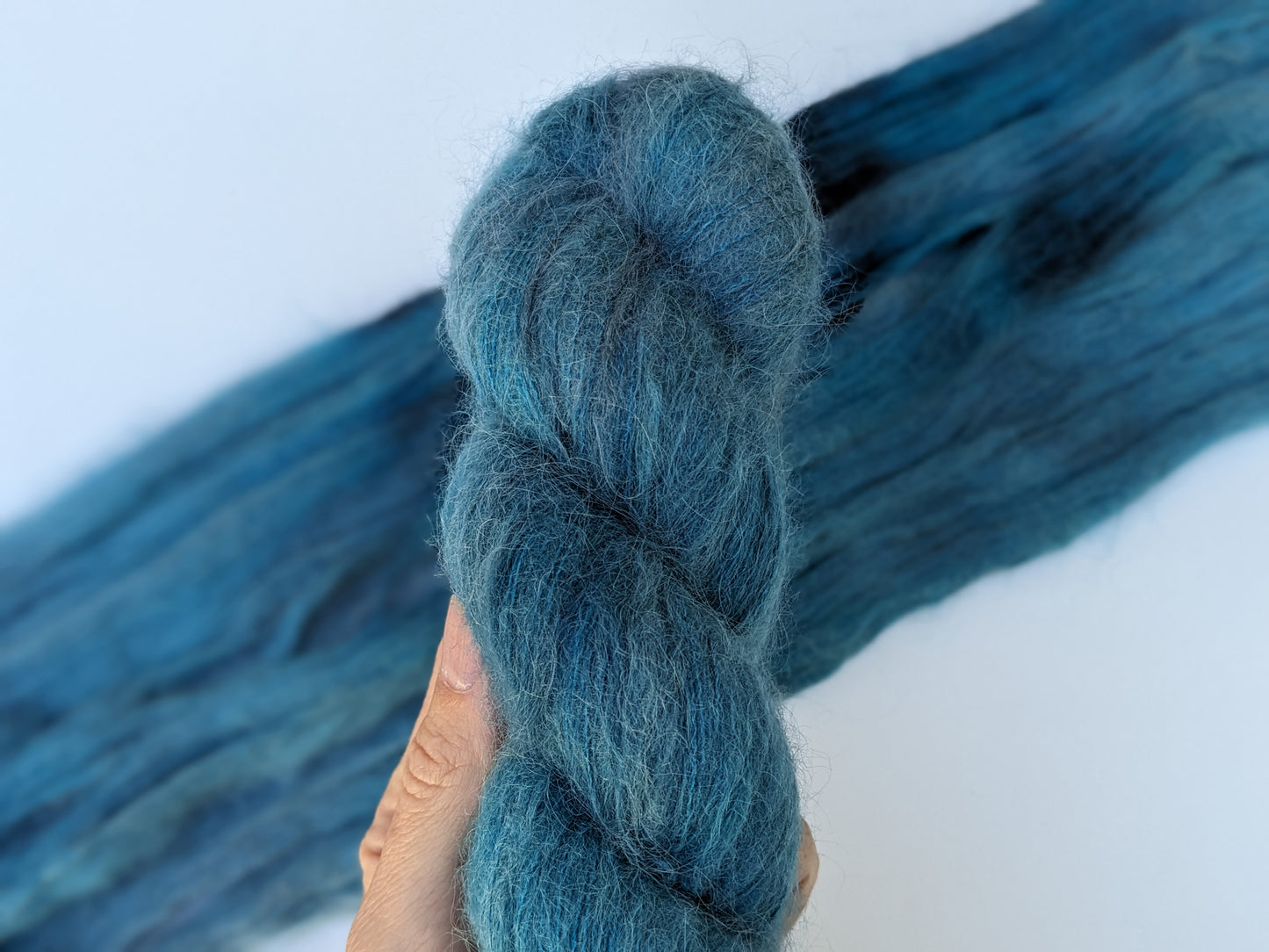 Tealicious Yarn skein in suri silk, showcasing vibrant teal color