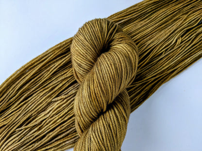 Colonel Mustard Yarn in fingering and DK weights, showcasing vibrant mustard yellow color