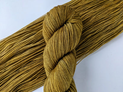 Colonel Mustard Yarn in fingering weight, showcasing vibrant mustard yellow color