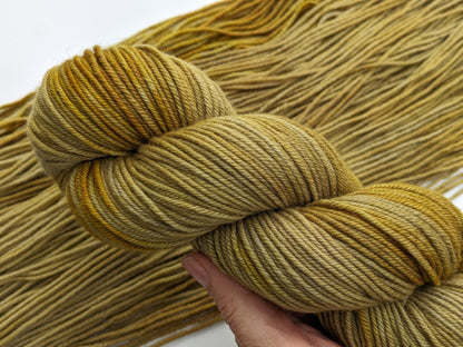 Colonel Mustard Yarn in non-superwash DK weight, showcasing vibrant mustard yellow color