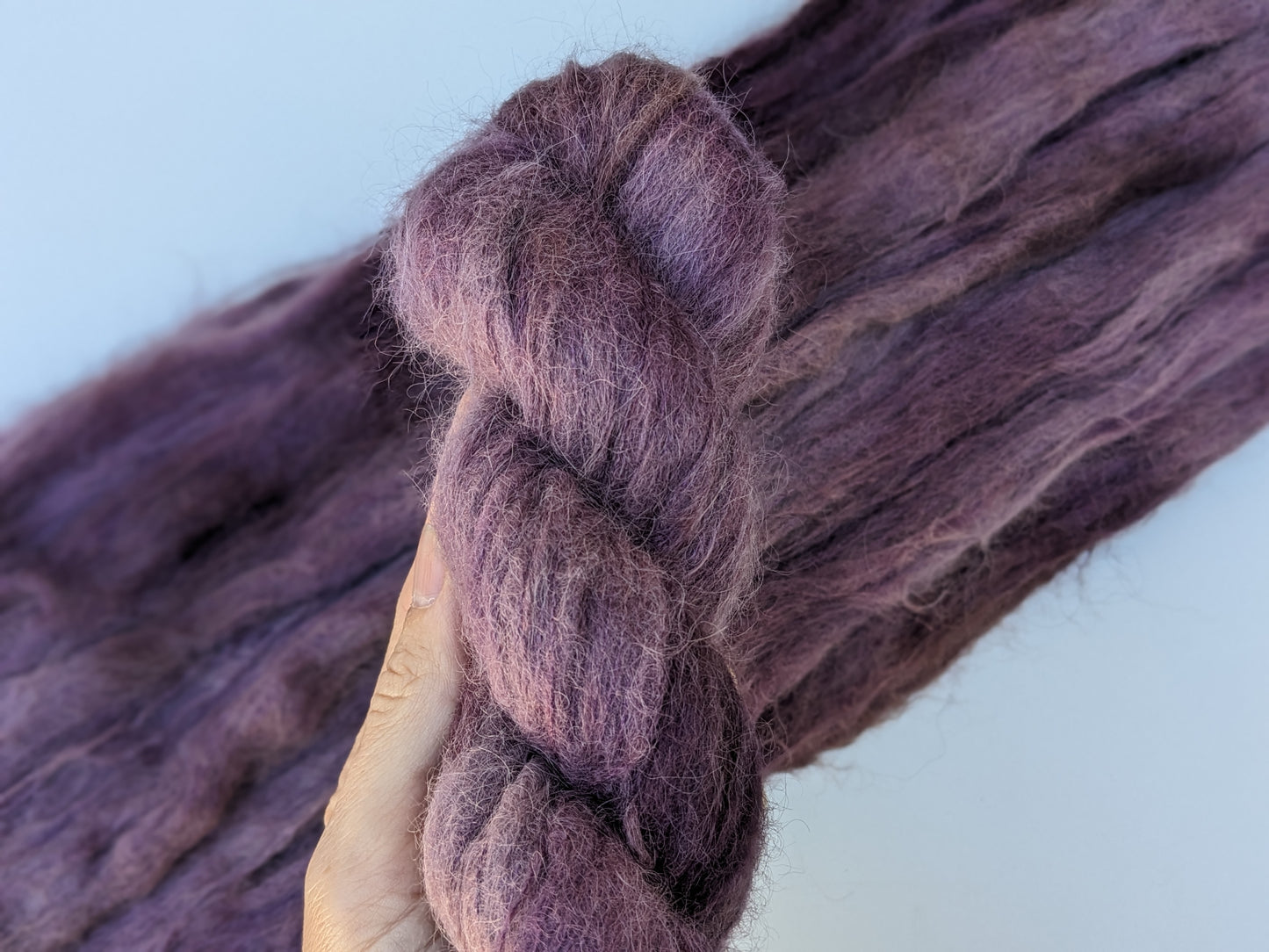 Grandma Yarn skein in suri alpaca and silk blend, showcasing hand-dyed purple color