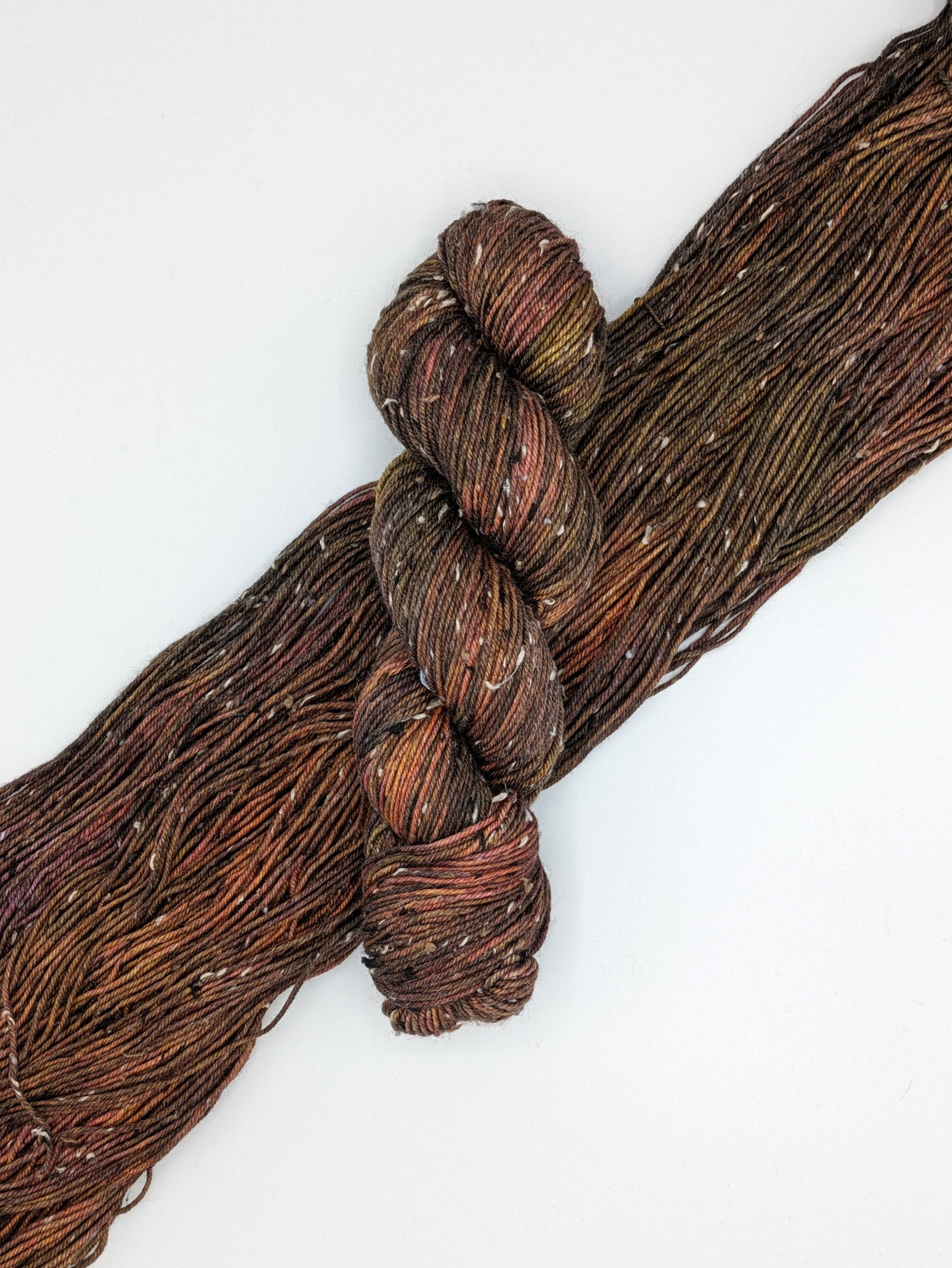 Mahogany Yarn Skein in tweed DK weight, showcasing rich brown tones