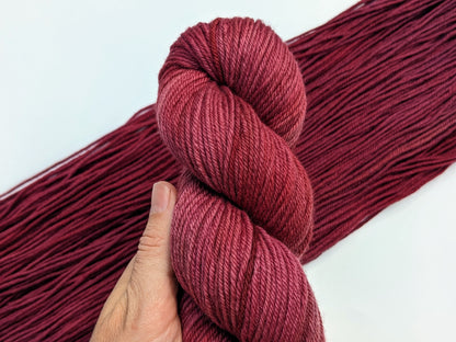 Merlot Yarn in non-superwash DK weight, showcasing deep wine color