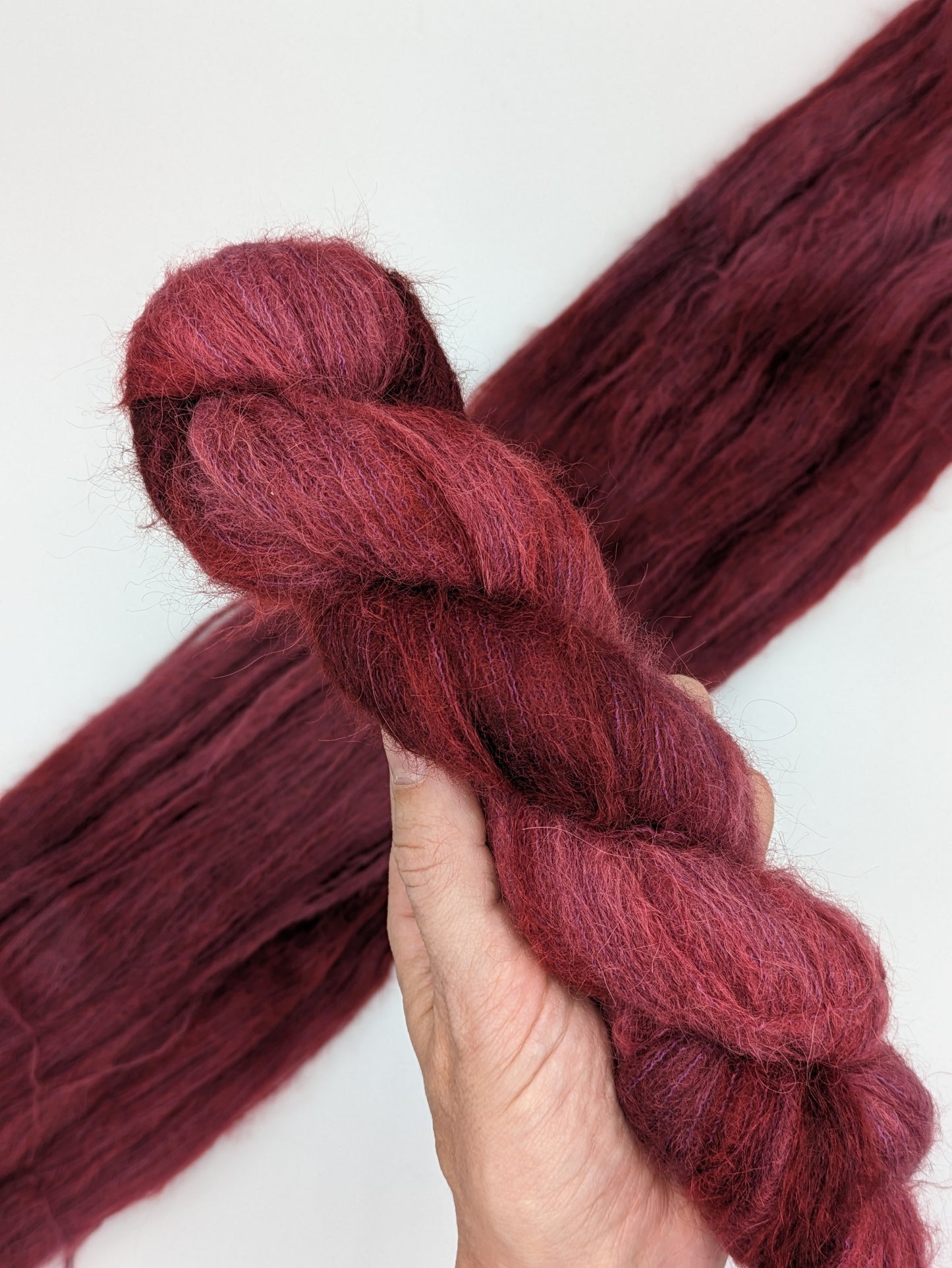 Merlot Yarn in suri silk weight, showcasing deep wine color