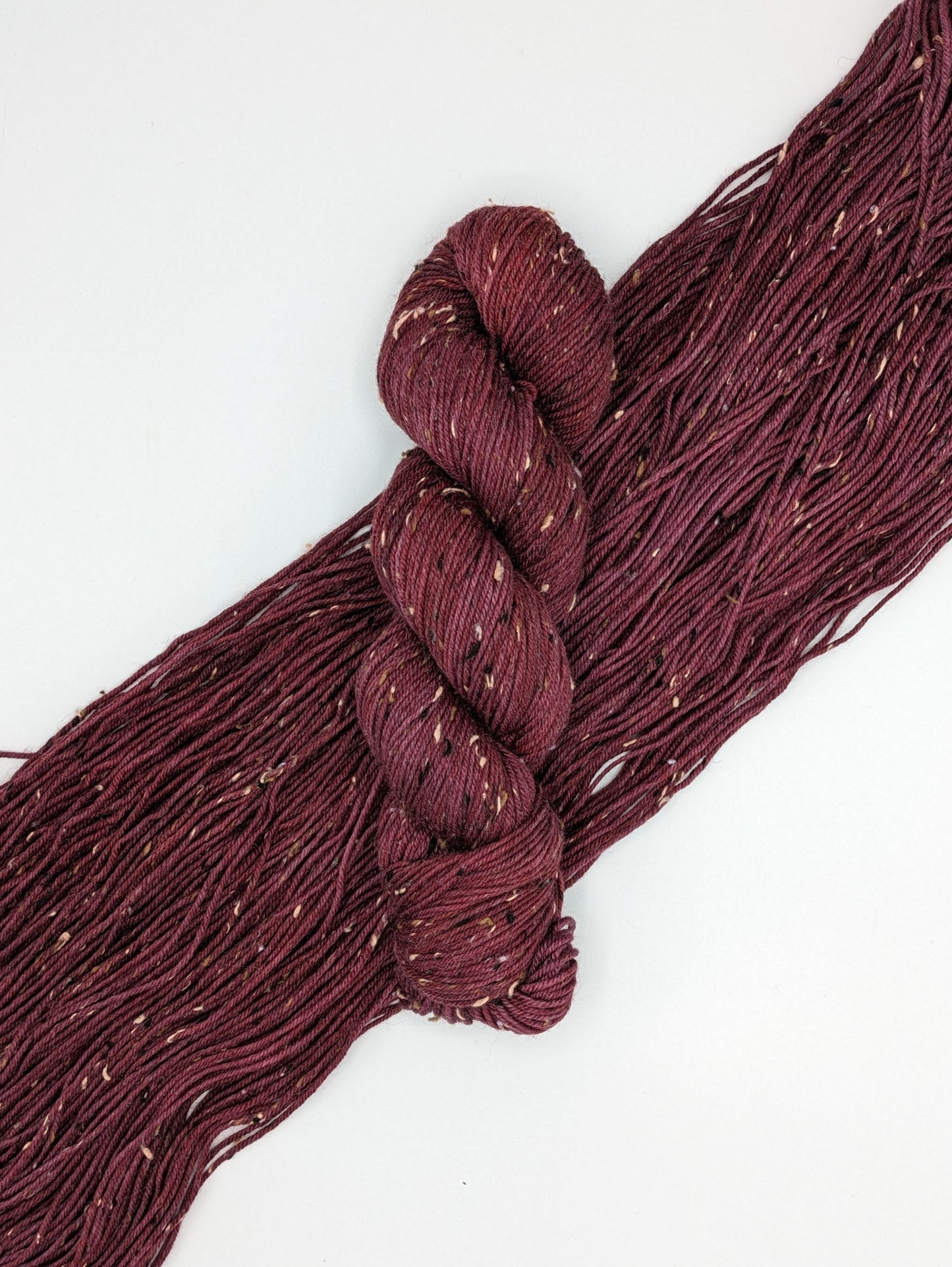 Merlot Yarn in tweed DK weight, showcasing deep wine color