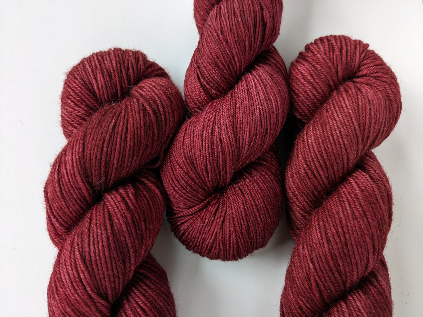 Merlot Yarn skeins, showcasing deep wine color