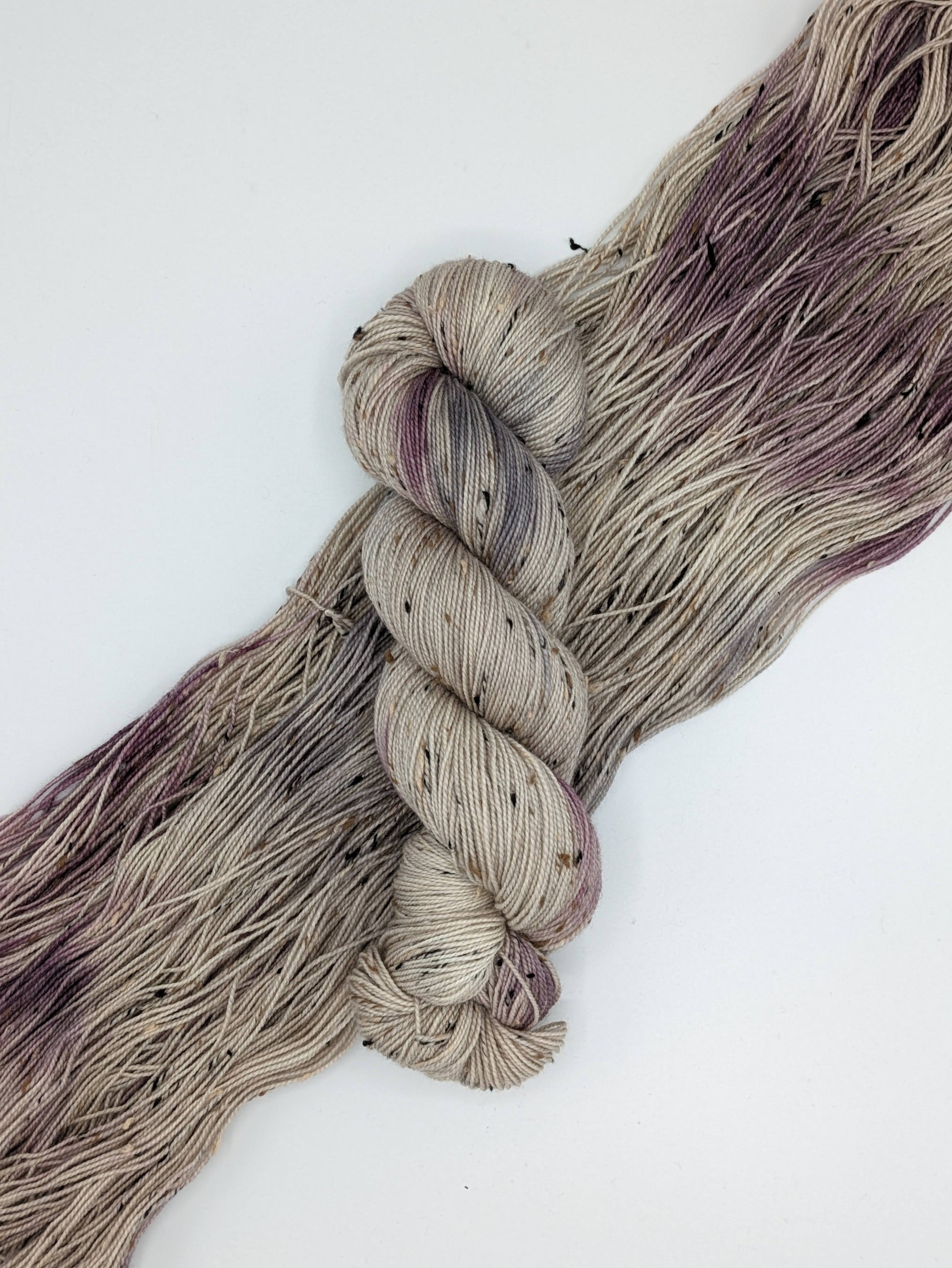 Natural Beauty Yarn in tweed fingering weight, showcasing natural hues