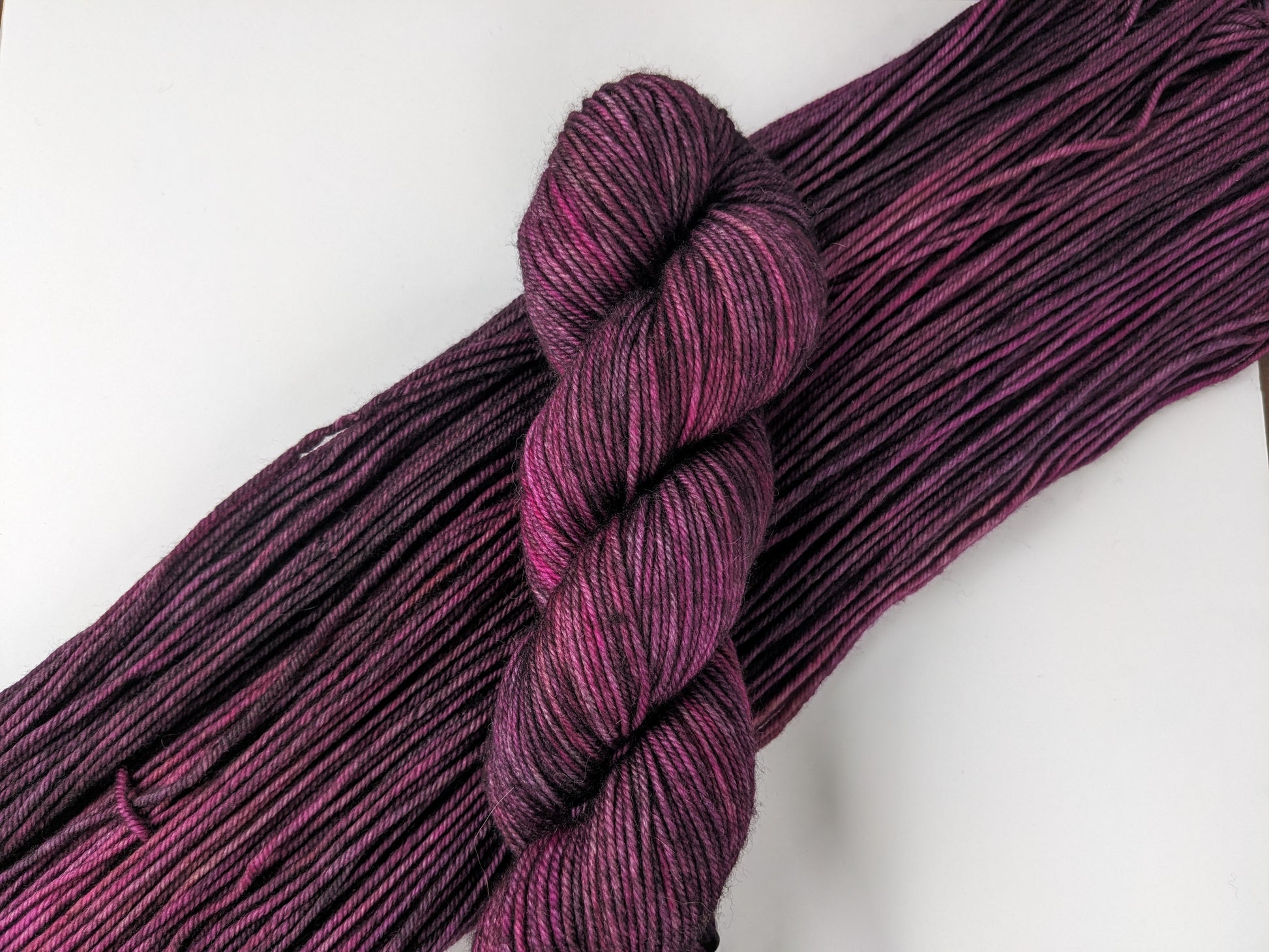 Purple Haze Yarn skein in DK weight, showcasing vibrant purple hues